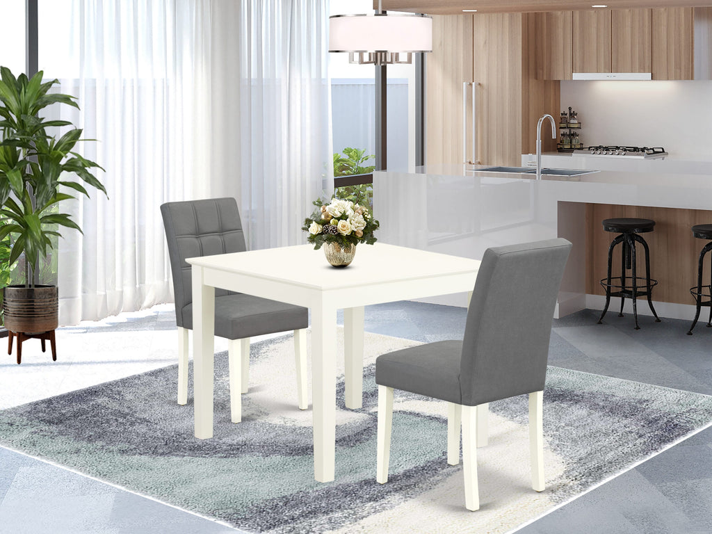 East West Furniture OXAS3-LWH-41 3 Piece Dinner Table Set consists A Dining Kitchen Table and 2 Platinum Gray Faux Leather Wood Chairs with Stylish Back- Linen White Finish